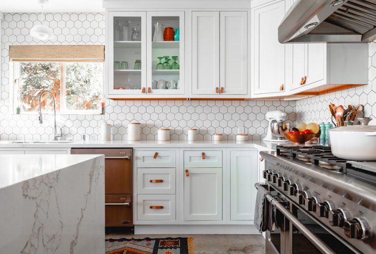 a kitchen with white cabinetry